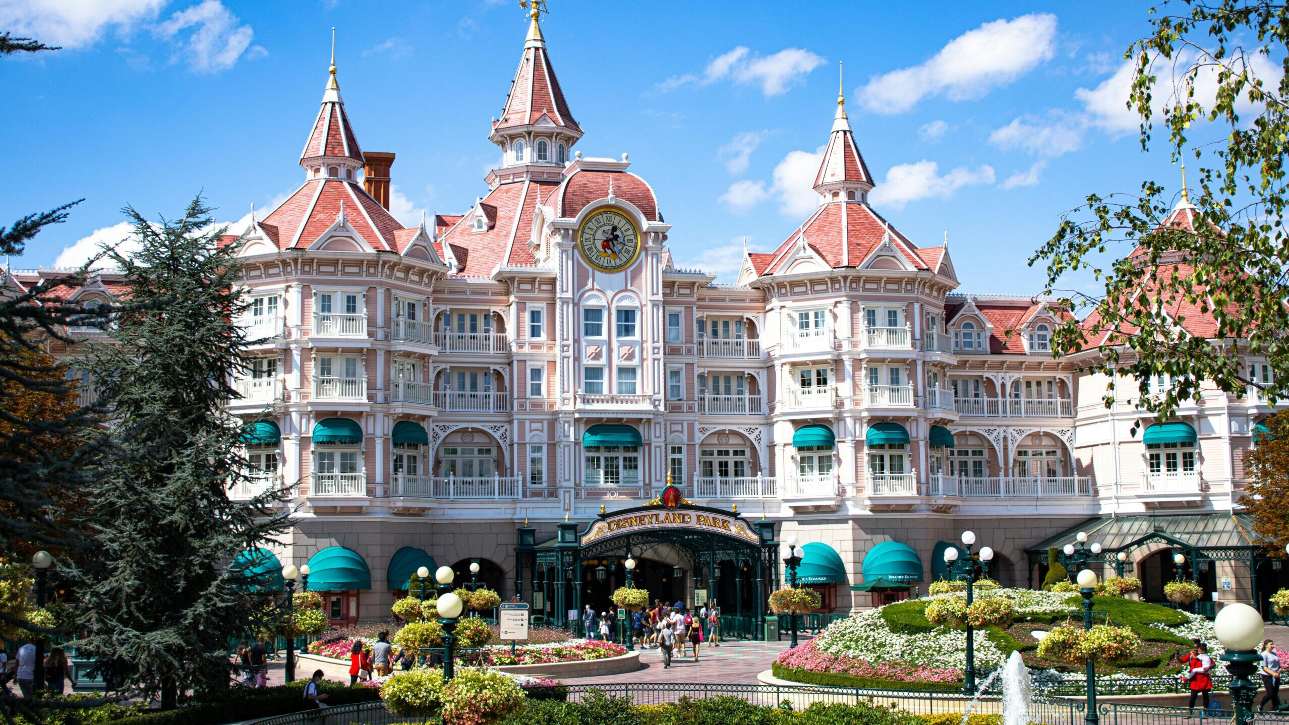Beautiful hotel entrance at Disneyland Paris with blue sky.