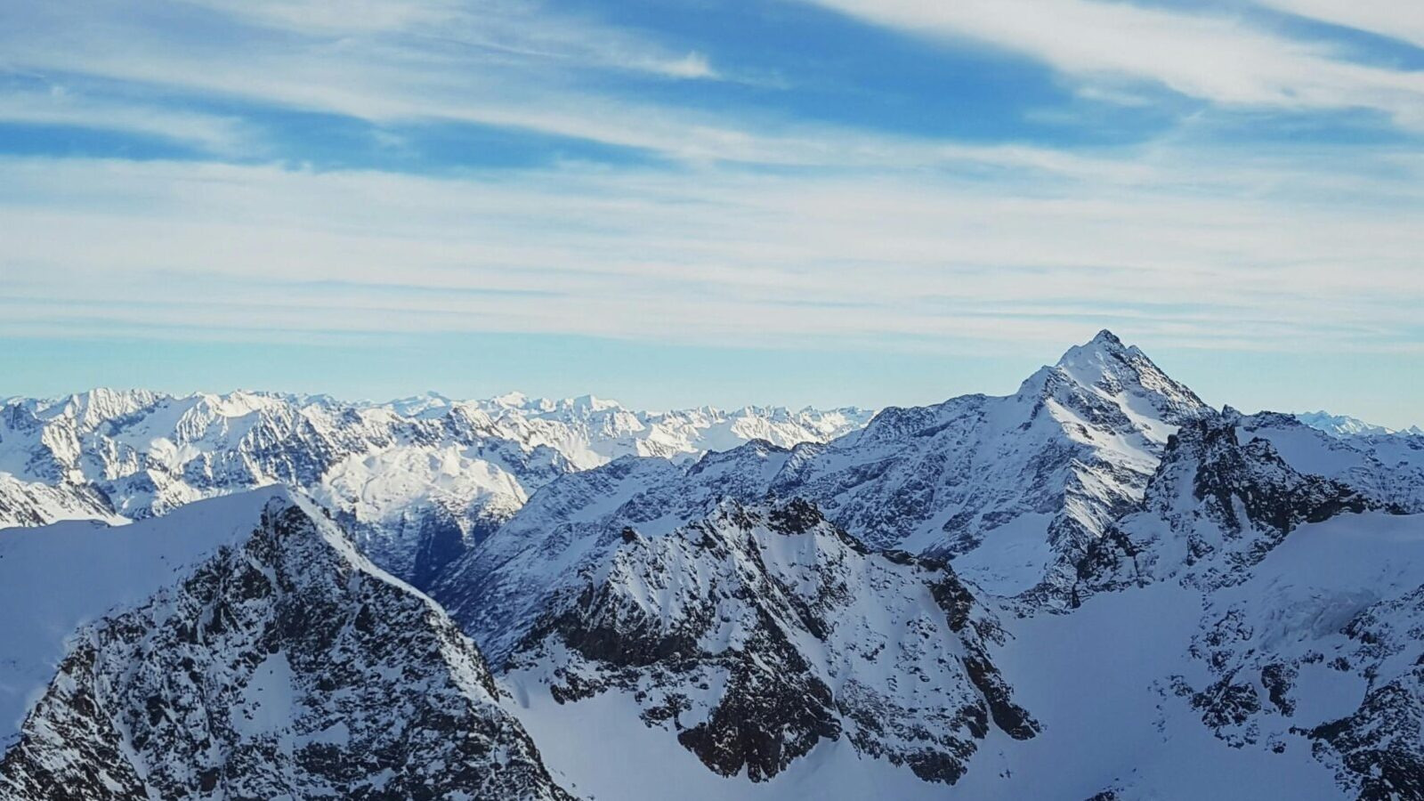 Stunning view of snow-covered mountain peaks in Engelberg, Switzerland.
