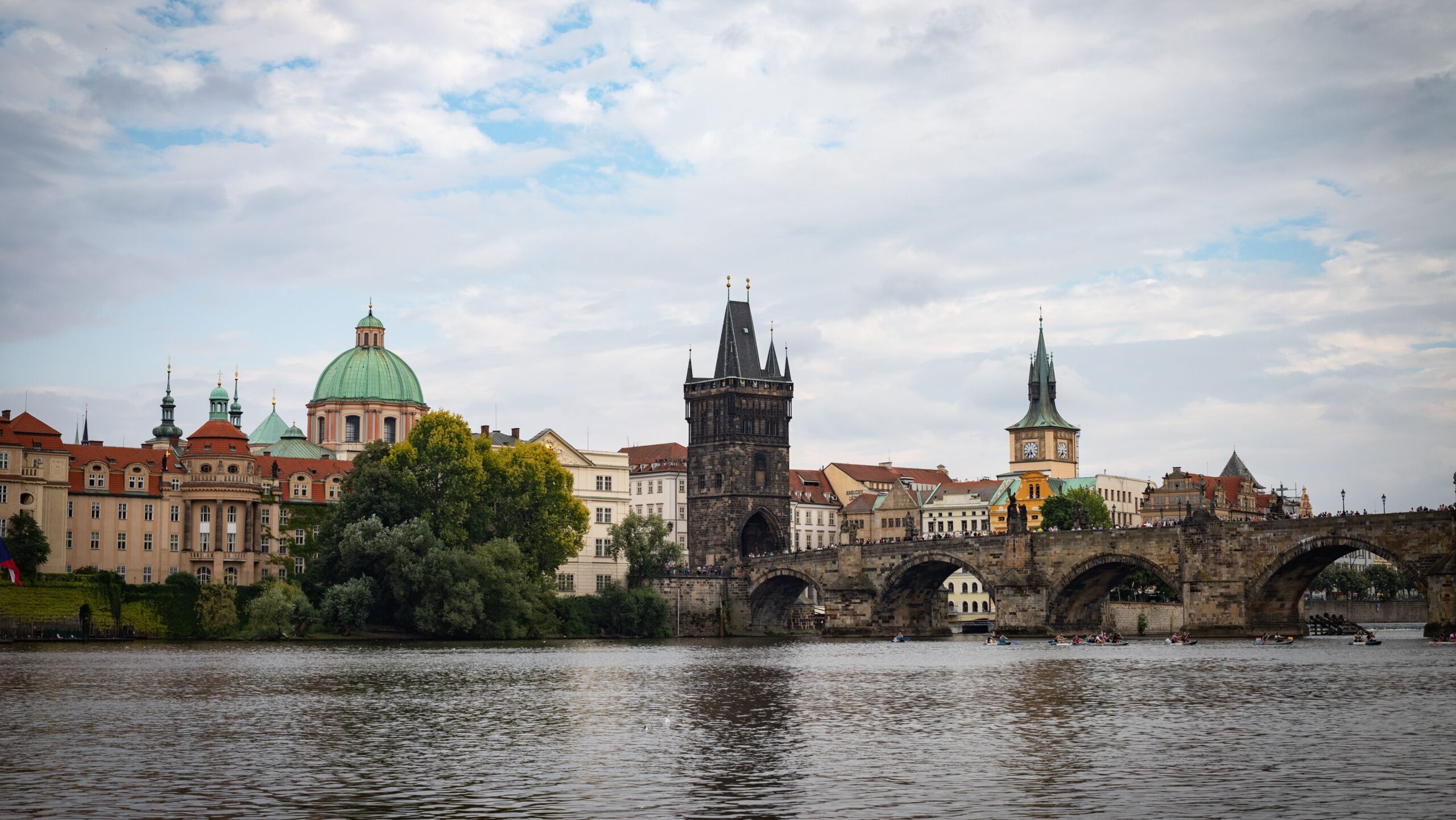 Stunning view of Charles Bridge with Prague's historic architecture and Vltava River.