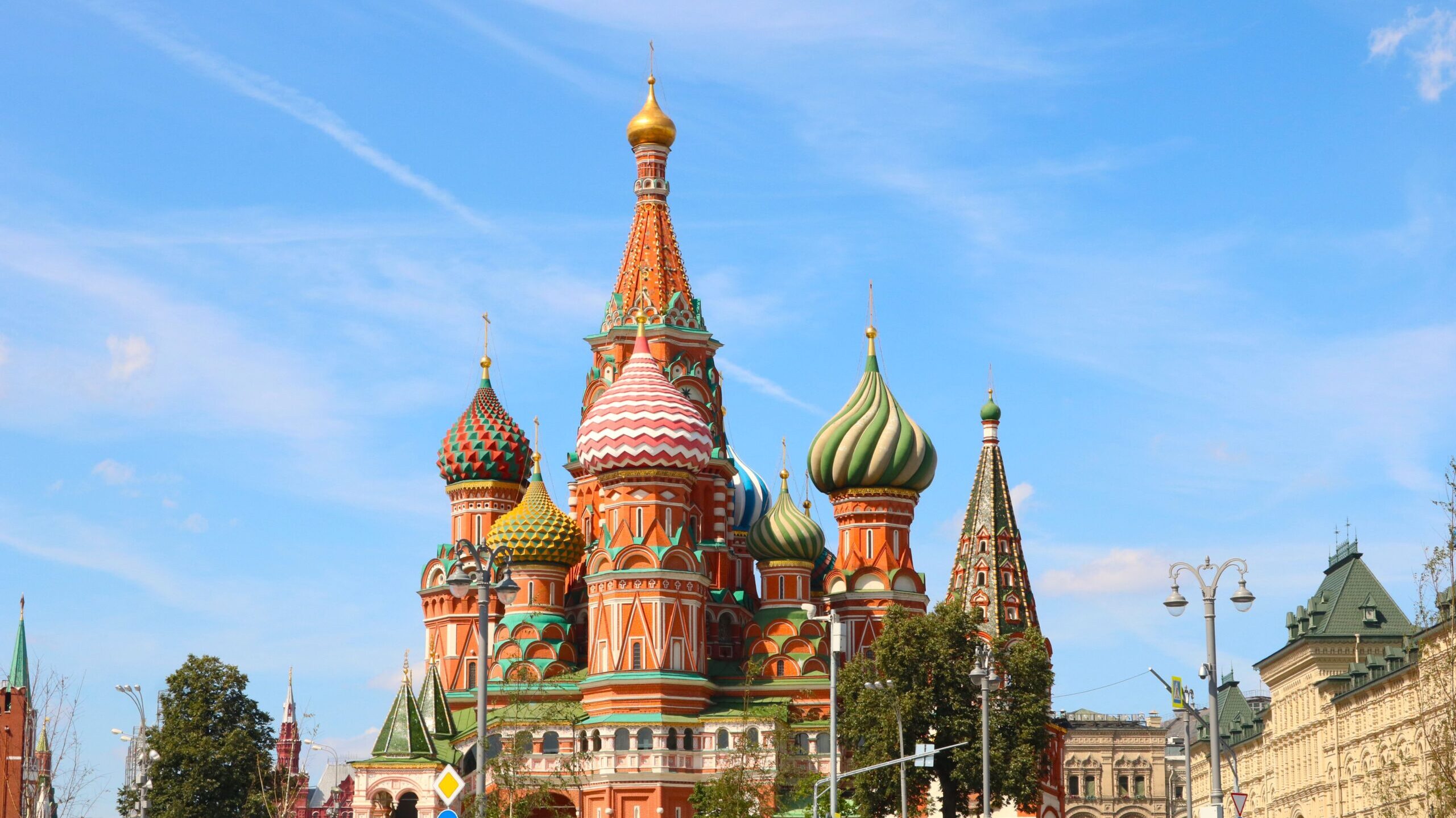 Iconic image of St. Basil's Cathedral with colorful domes in vibrant Moscow, Russia under a clear sky.