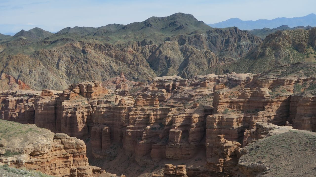 Breathtaking view of Charyn Canyon with rugged formations under a clear sky in Kazakhstan.