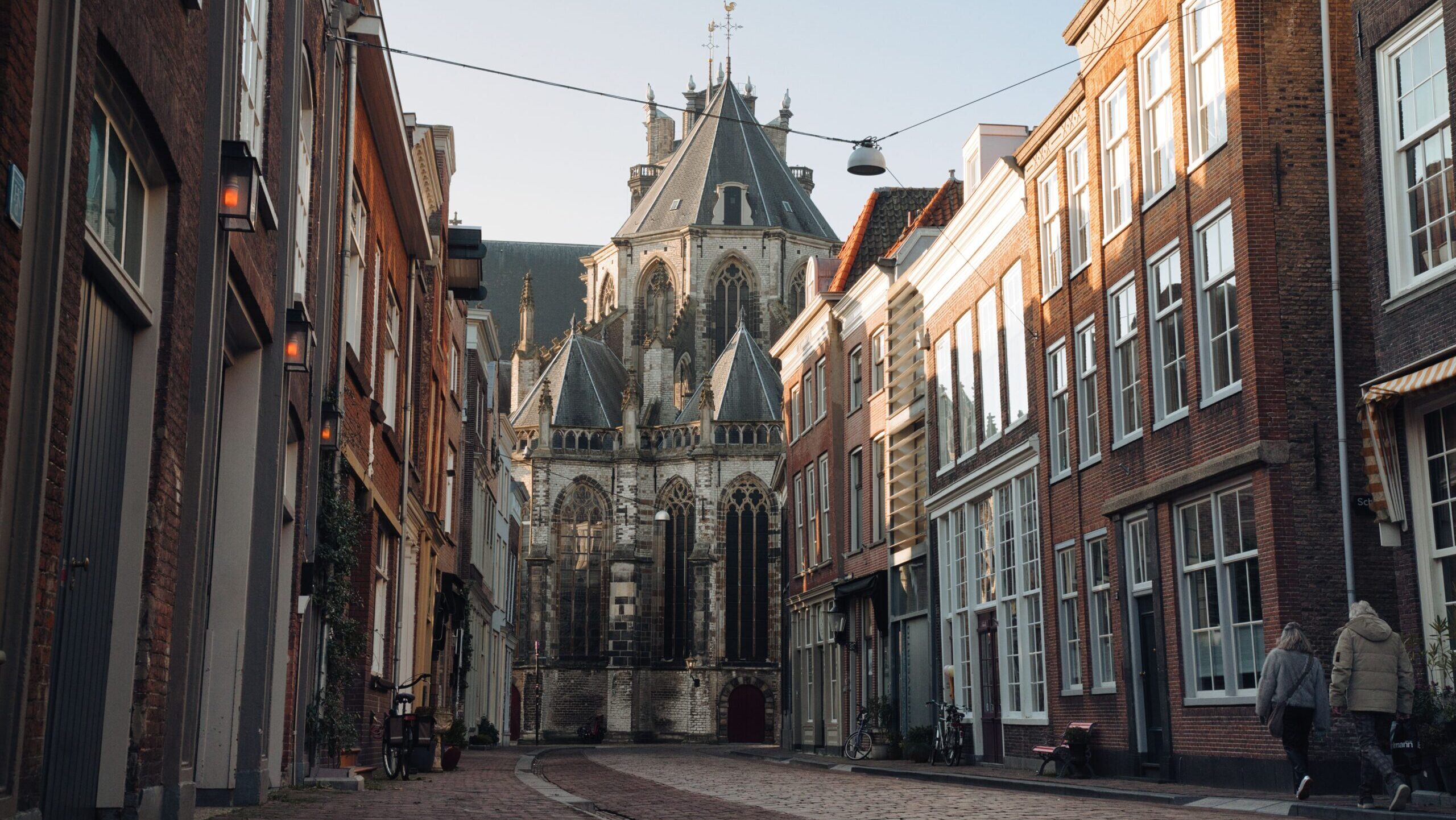 Charming street view of Dordrecht with stunning historic architecture captured in daylight.
